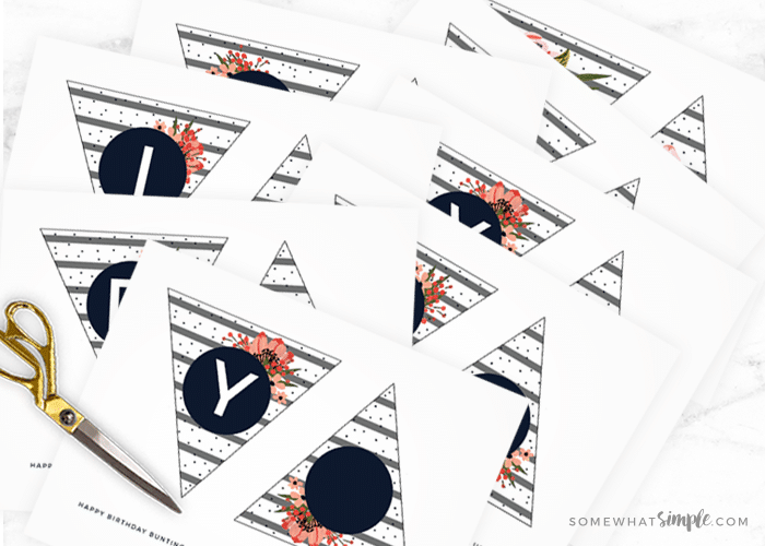 cutting out trianle pieces for a birthday banner