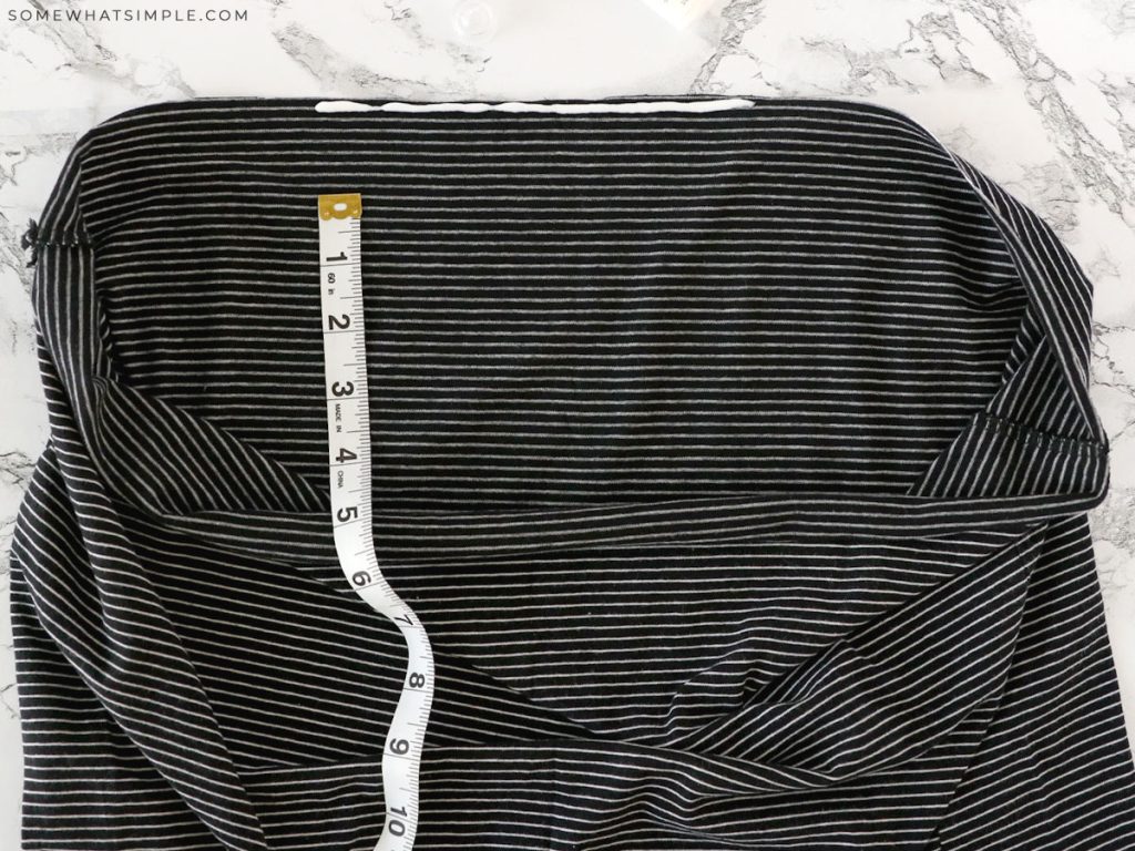 measuring a man's shirt to make a girls skirt