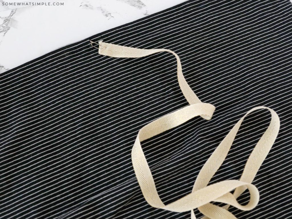 threading a drawstring through a casing to make a skirt