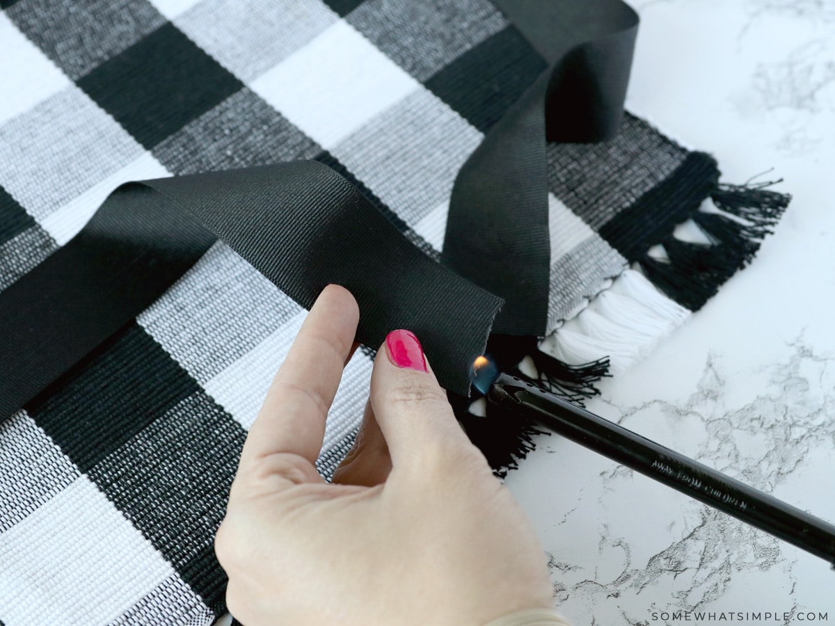 burning the edges of a ribbon to keep it from fraying