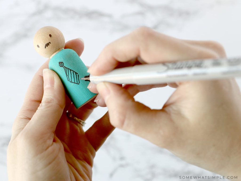 drawing clothes on a Wooden Spool Doll