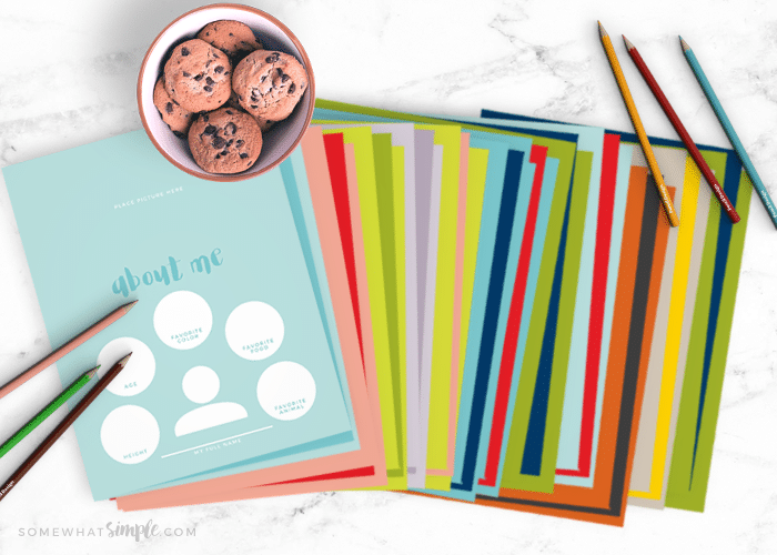 Printable journal pages for kids spread out on a counter