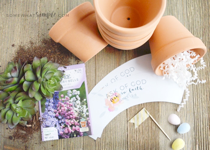 supplies needed to make mini terra cotta pots with a cute printable wrapper on them.