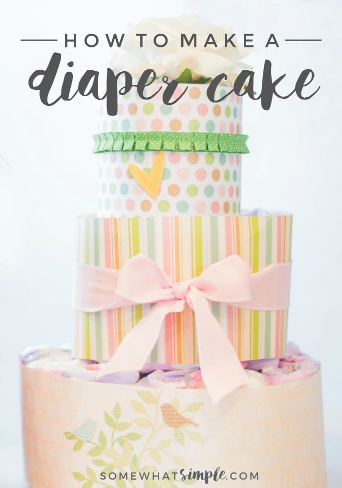 How to make a diaper cake a three layered diaper cake wrapped in paper and ribbon