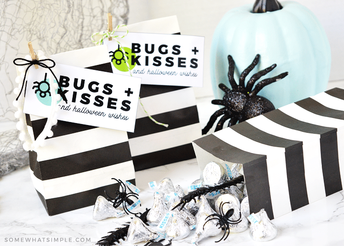 halloween gift bags with bugs and kisses tags attached
