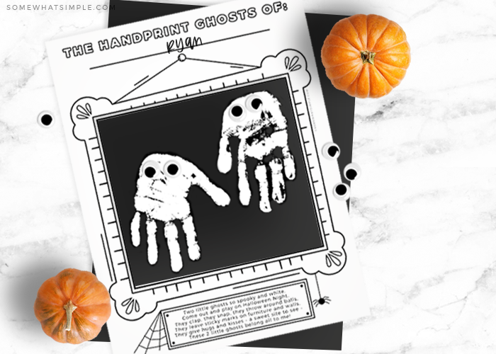 ghost craft for kids with white handprints shaped like a ghost on a black square