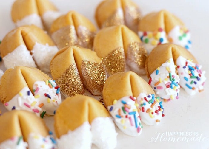Fortune Cookies dipped in chocolate with sprinkles and edible glitter