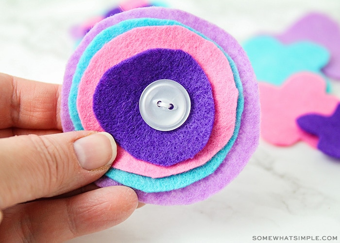 purple, blue and pink pieces of felt that have been sewn together