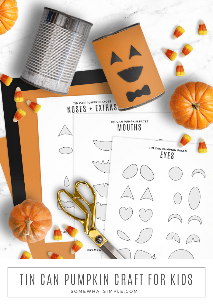 tin can pumpkins laying on the counter with printable faces
