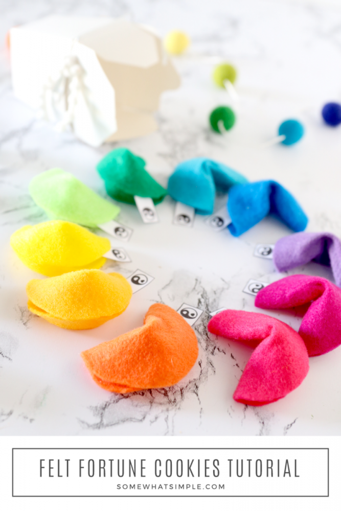 fortune cookies made from felt forming a circle on the counter with a Chinese takeout box in the background