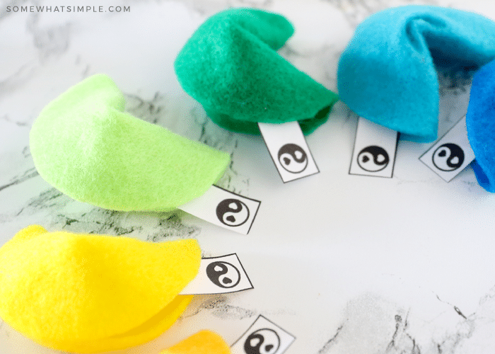 felt fortune cookies with strips of paper inside