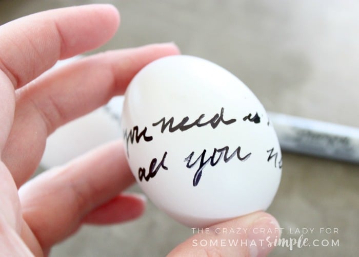 Learn how to make love letter script Easter eggs with this super simple, 2 supply, DIY tutorial. You'll love this black and white Easter egg craft!