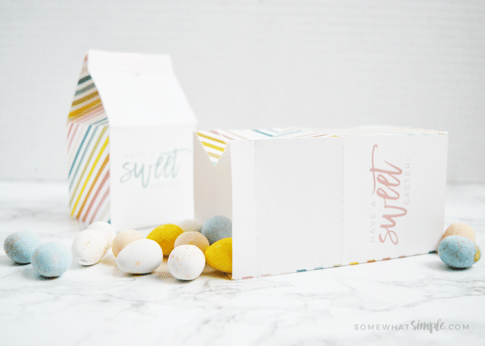 Easter treat box laying on its side with candies coming out of it