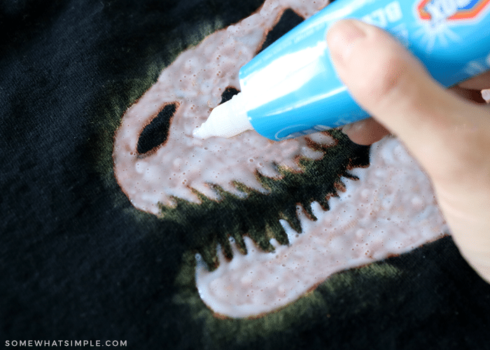 coloring a shirt with a bleach pen