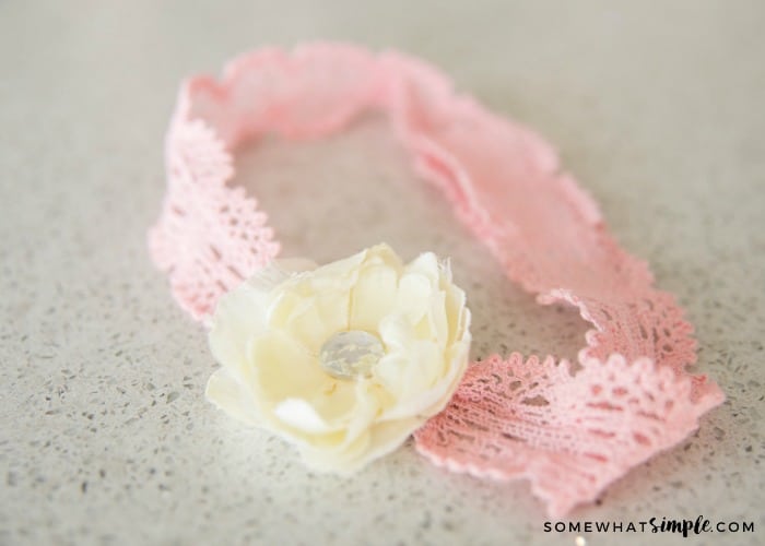 pink headband with a whit flower