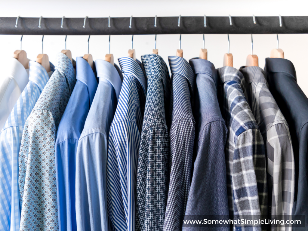 mens dress shirts hanging in a closet