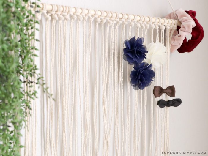 diy bow holder hanging on a wall