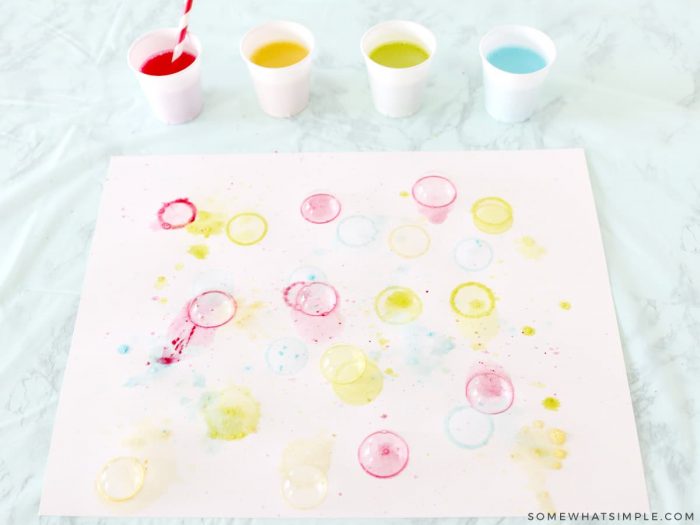 blowing bubbles onto paper