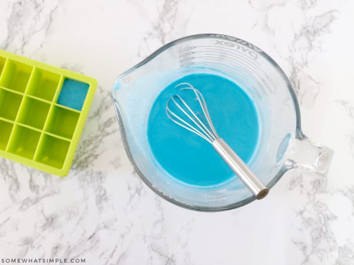 adding water to a glass measuring cup