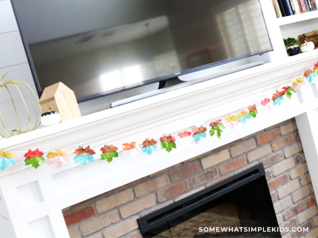 further away shot of a Painted Leaves Craft banner over a fireplace