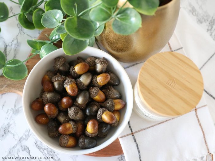 glittered acorns in a bowl