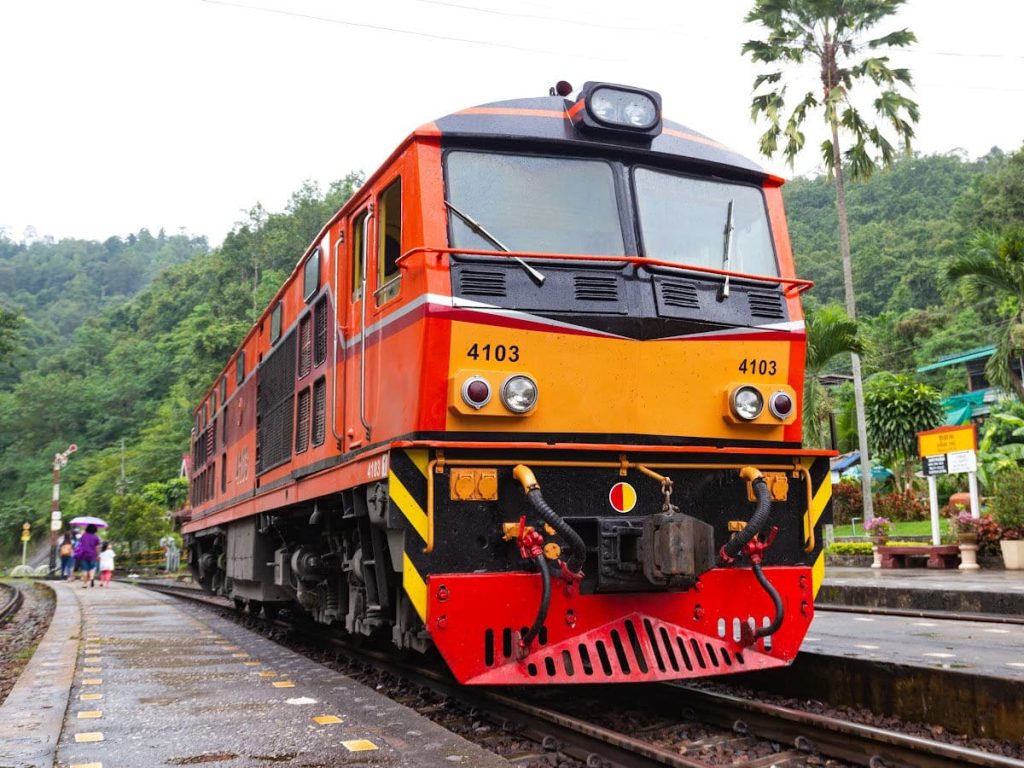 red and yellow train on the track