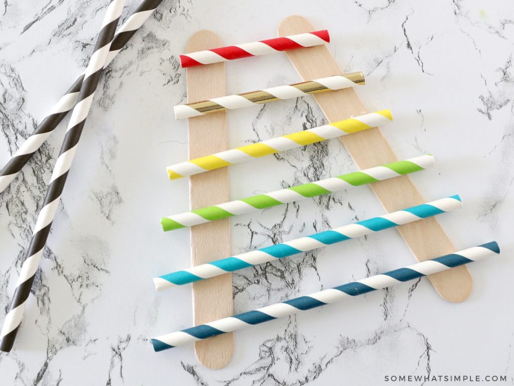 how to make a paper xylophone with popsicle sticks and paper straws