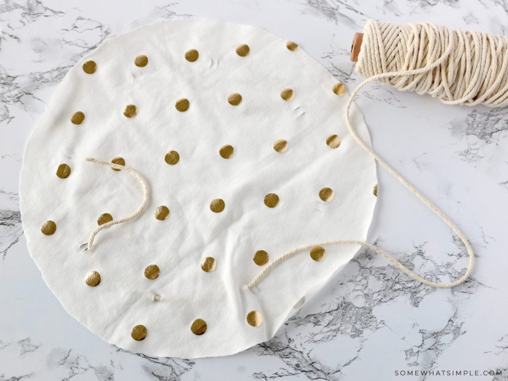 polka dot fabric cut into a circle with twine to the side of it