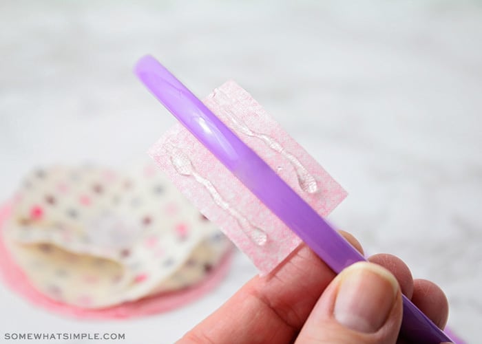 holding a purple headband