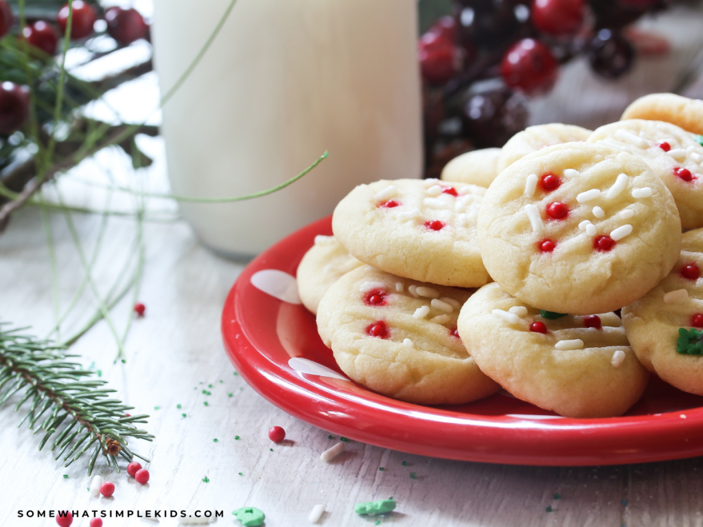 red plate filled with christmas cookies