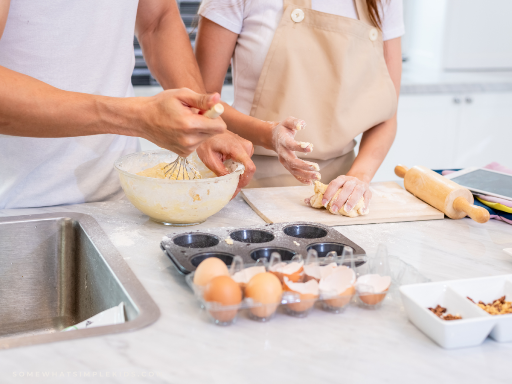 family hands cooking in the kitchen