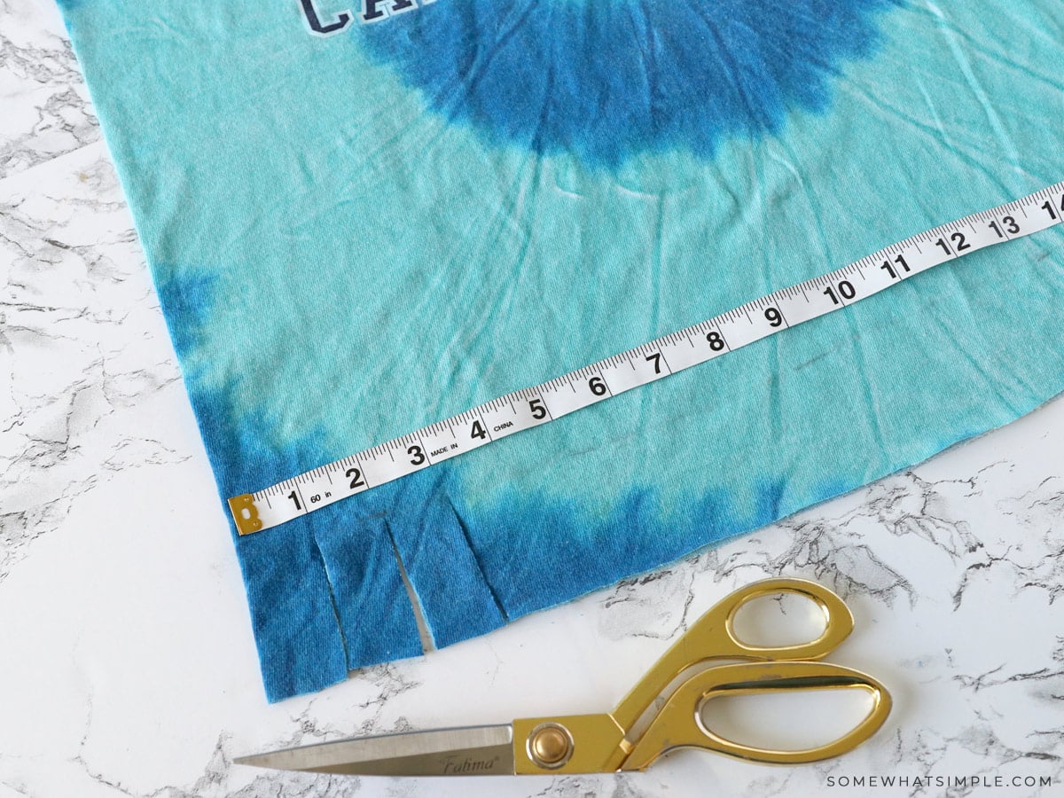 cutting fringe on the bottom of a t shirt