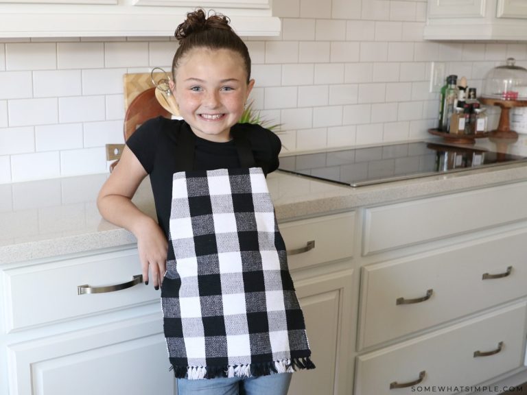 addie wearing a black and white apron made from a placemat
