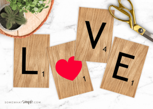 Printable L-O-V-E Scrabble Tiles on a white background.