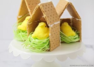 peeps candies inside a graham cracker house with edible easter grass