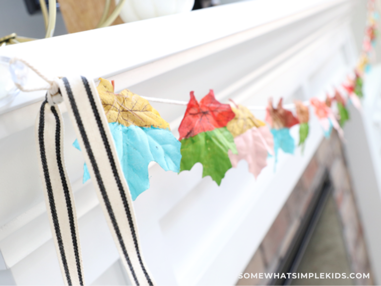 close up of a painted leaf craft made into a banner