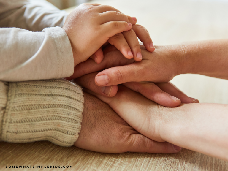 family hands stack on top of each other